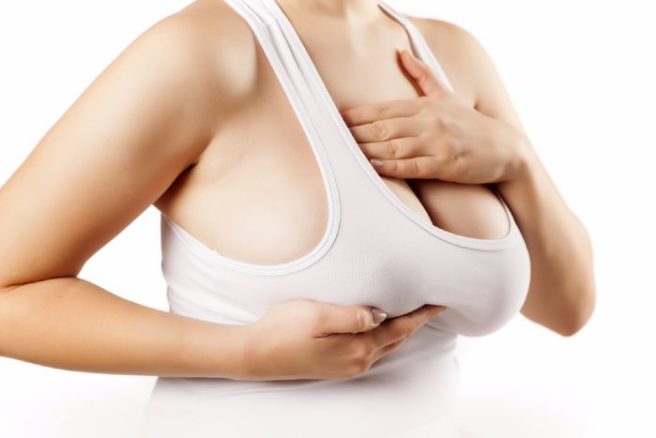 What are the symptoms of Breast Cancer